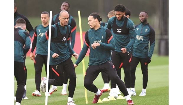 Liverpoolu2019s Virgil van Dijk (right) with Fabinho train with their teammates ahead of their Champions League semi-final. (Reuters)