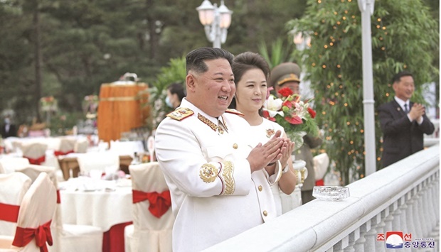 North Korean leader Kim Jong-un and his wife Ri Sol-ju applaud during an event at the headquarters of the Central Committee of the Workersu2019 Party to mark the 90th anniversary of the founding of the Korean Peopleu2019s Revolutionary Army in Pyongyang. (Reuters)