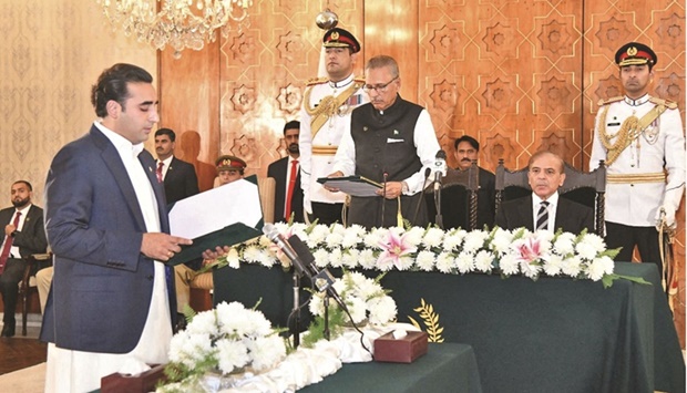 Bilawal Bhutto Zardari taking oath as foreign minister from President Arif Alvi in Islamabad yesterday. (Reuters)