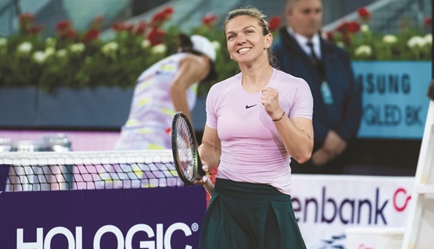 Simona Halep of Romania smiles after beating Chinau2019s Zhang Shuai at the Madrid WTA Tour event yesterday.