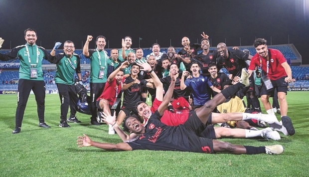 Al Rayyan players and support staff celebrate after their win over Al Hilal in the final Group A match of the AFC Champions League in Riyadh on Wednesday.
