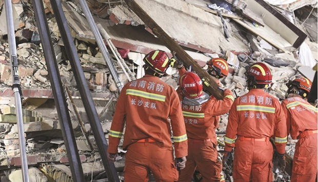 Rescuers searching for survivors at a collapsed six-storey building in Changsha, central Chinau2019s Hunan province.