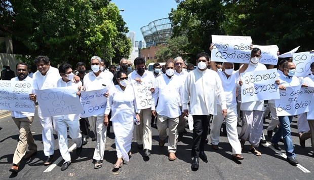 Sri Lankau2019s main opposition leader Sajith Premadasa (C) and parliament members march during a protest in Colombo on April 3, 2022.