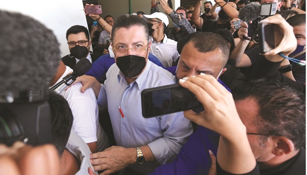 Figueres speaks to the media after casting his vote at the San Cristobal Sur school in La Lucha, Costa Rica.