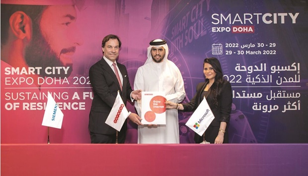 Officials of Ooredoo, Siemens, and Microsoft during the signing ceremony at Smart City Expo 2022.