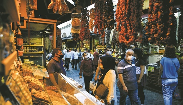 People shop at the Spice Market also known as the Egyptian Bazaar in Istanbul (file). Month-on-month consumer prices rose 5.46%, the Statistical Institute said, just below a Reuters poll forecast of 5.7%.