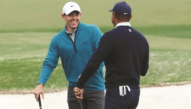 Northern Irelandu2019s Rory McIlroy (left) and Tiger Woods of the US share a laugh during the practice round for The Masters at the Augusta National Golf Club in Georgia yesterday. (Reuters)