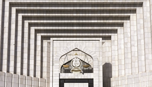 A general view of balance scale with the logo, that reads u2018So judge between the people in truthu2019, on the Supreme Court of Pakistan building in Islamabad.