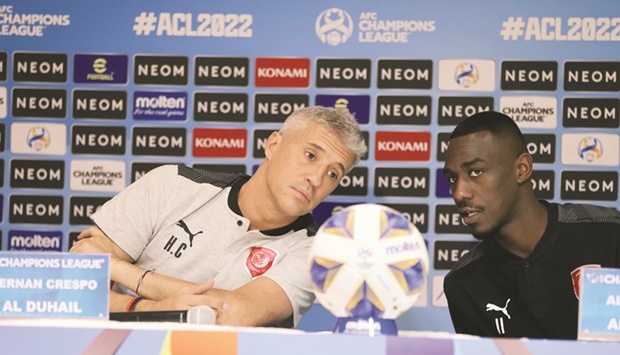 Al Duhailu2019s coach Hernan Crespo (left) and striker Almoez Ali during a press conference at the King Abdullah Sports City Stadium in Buraidah, Saudi Arabia.