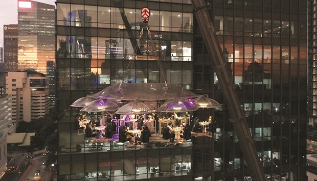This aerial picture taken on April 6 shows guests enjoying dinner some 50 metres above ground at the Lounge in the Sky, in Jakarta.