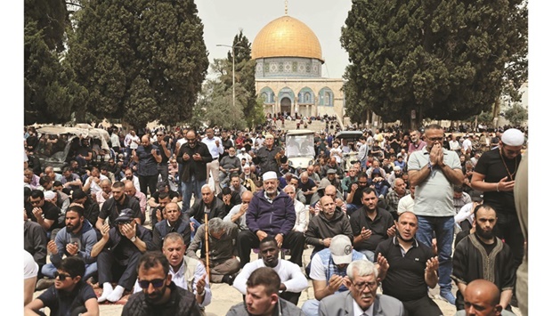 Palestinian worshippers gather at the mosque in the Old City of Jerusalem to attend Ramadan Friday prayers, yesterday.