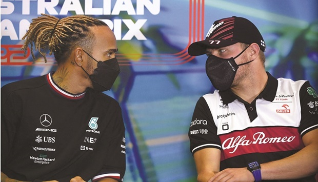 Mercedesu2019 Lewis Hamilton (left) and Alfa Romeou2019s Valtteri Bottas attend a press conference at the Albert Park Circuit in Melbourne yesterday, on the eve of Australian Grand Prix. (AFP)