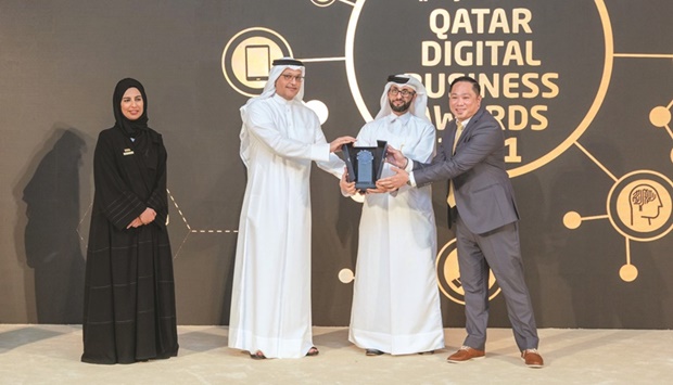 HE the Minister of Communications and Information Technology Mohamed bin Ali bin Mohamed al-Mannai handing over the award to CWallet CEO and founder Michael Javier and CWallet co-founder and COO Dr Abdulmohsin al-Yafei during the Qatar Digital Business Awards 2021 held recently.