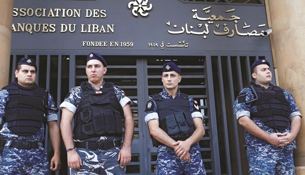 Lebanese police stand outside the entrance to the Association of Banks in downtown Beirut (file). An IMF agreement is widely seen as the only way for Lebanon to start emerging from what the World Bank has described as one of the worldu2019s worst ever financial collapses u2014 and the deepest crisis since Lebanonu2019s 1975-90 civil war.