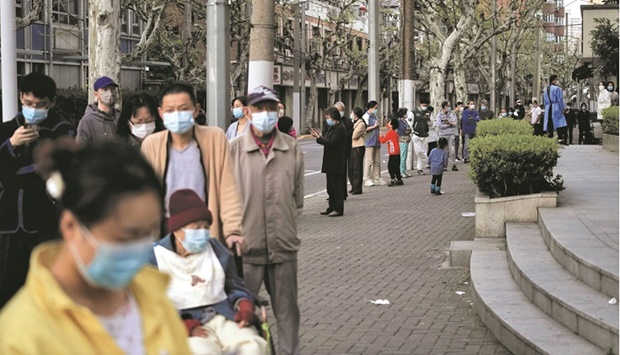 Residents line up for nucleic acid test during a lockdown in Shanghai.