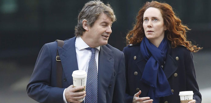 Former News International chief executive Rebekah Brooks arrives with her husband Charlie at the Old Bailey courthouse in London yesterday.