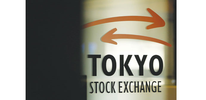    The Tokyo Stock Exchange logo is displayed on a glass door at the bourse in Tokyo. Japanese stocks closed down 0.23% at 15,424.59 points yesterday.