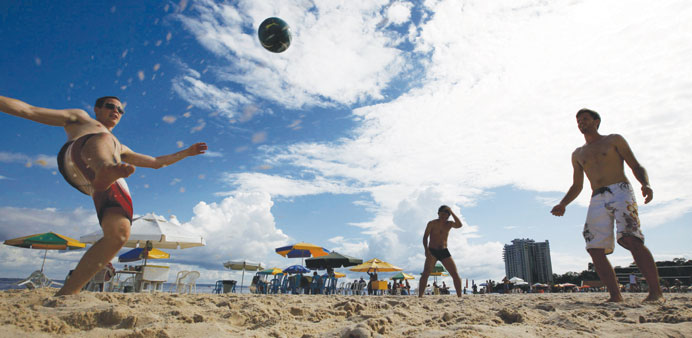 Life is a beach: Brazilian youths play soccer at the Ponta Negra beach in the Amazon city of Manaus.