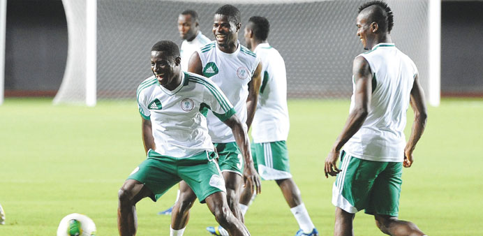 Nigeria players Uwa Echiejile (centre) and Brown Ideye (right) in action during a training session yesterday in Salvador. (EPA)
