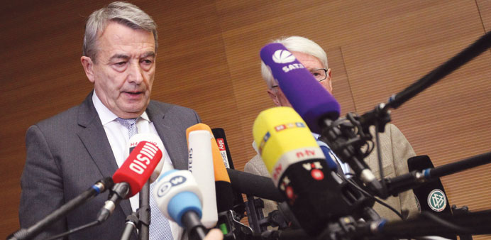 Wolfgang Niersbach (L), President of the German Football Federation (DFB) delivers a statement to announce his resignation.