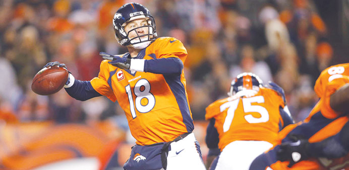 Denver Broncos quarterback Peyton Manning passes the ball during the first half against the San Diego Chargers at Sports Authority Field at Mile High 