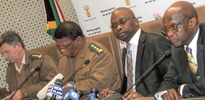 South African Justice Minister Michael Masutha (second right) at a press conference to announce that de Kock was denied parole after serving 20 years 