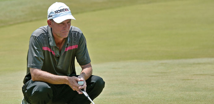 Anders Hansen of Denmark eyes a putt during round three of The Championship golf tournament at Laguna National in Singapore yesterday. (AFP)