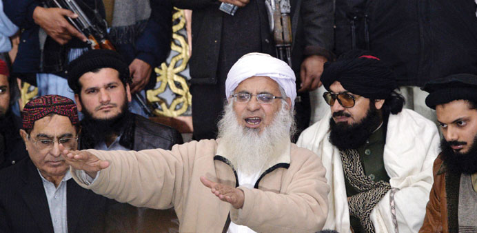 Maulana Abdul Aziz, centre, speaking during a press conference in Islamabad yesterday.