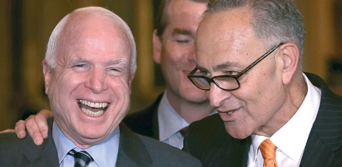 Sen. John McCain (left) and Sen. Charles Schumer share a moment.