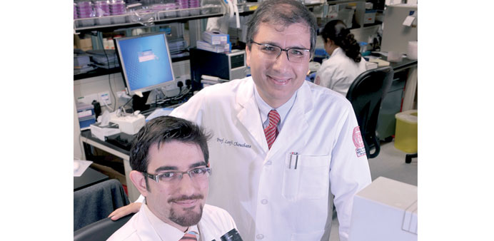   Maen Abou Ziki in lab with a WCMC-Q mentor.