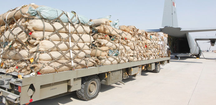 A trailer carrying flood aid to Sudan waits to be unloaded at Doha airport yesterday.