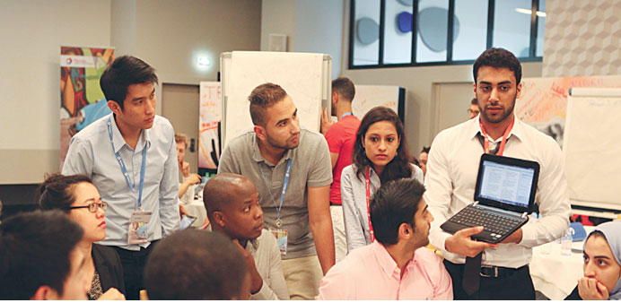 Al-Buainain taking part in a team project discussion with other students.