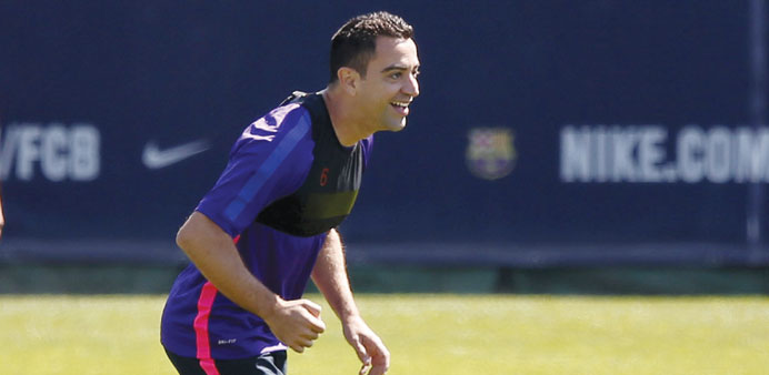 Barcelonau2019s Xavi Hernandez smiles during a training session in Sant Joan Despi.