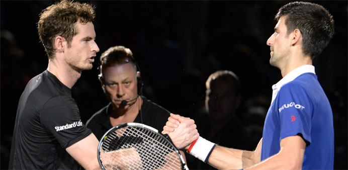 Serbia's Novak Djokovic (R) shakes hands with Britain's Andy Murray after winning the finals