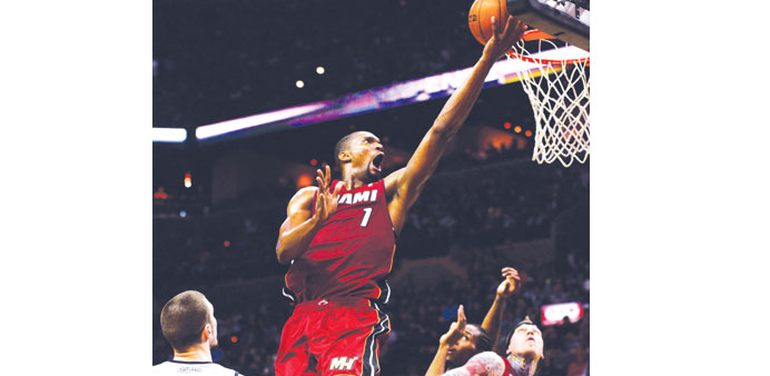 Miami Heatu2019s Chris Bosh goes to the basket against the San Antonio Spurs in the first half of their NBA game in San Antonio, Texas, on Sunday. (EPA)