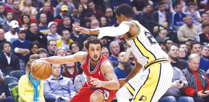    Indiana Pacers forward Paul George (left) guards Chicago Bulls guard Marco Belinelli of Italy closely during the second half of the  game in Indian