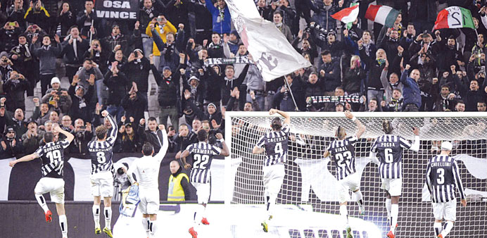 Juventus players celebrating their win against Parma in Turin on March 26. (File Photo)