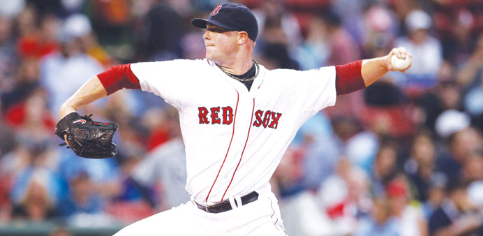 Boston Red Sox pitcher Jon Lester leads off against the Tampa Bay Rays during their MLB American League Baseball game in Boston on Tuesday.