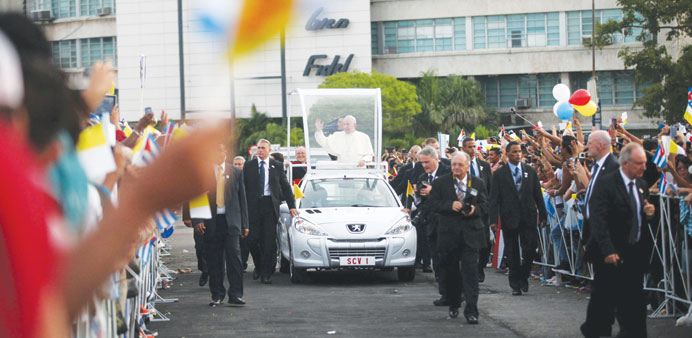 Pope Francis waves upon arriving in Havanau2019s Revolution Square yesterday. 