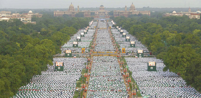 Thousands of participants perform yoga on Rajpath in New Delhi yesterday.