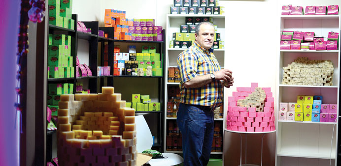 THE SHOP: Abdul Wahed Hassoun at his soap outlet by the Katara Beach. Photos by Anand Holla