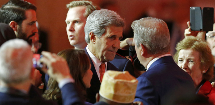 US Secretary of State John Kerry (L) speaks with Al Gore, former U.S. Vice President and Climate Reality Project Chairman, at the World Climate Change