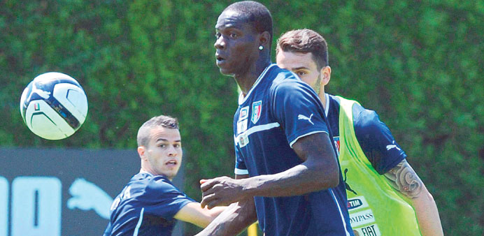 Italyu2019s Mario Balotelli (centre) in action with teammates during a training session in Coverciano, near Florence, Italy, yesterday. (EPA)