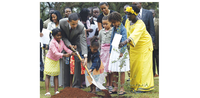 An August 28, 2006 file photo of then-US Senator Barack Obama with 2005 Nobel Prize Wangari Maathai planting a tree during a ceremony in Nairobi.