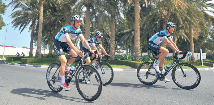 British rider Mark Cavendish (centre) of Omega Pharma-QuickStep team cycles during a training session in Doha yesterday.