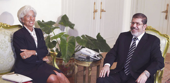 Egyptu2019s President Mohamed Mursi with IMF Managing Director Christine Lagarde at the presidential palace in Cairo, in this August 22, 2012 file photo.
