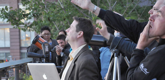 * Jason Kendall (centre with laptop), a professor at William Patterson University of New Jersey, lectures on astronomy to enthusiasts in Manhattanu2019s H