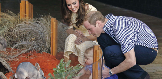 Catherine, the Duchess of Cambridge, and her husband Britainu2019s Prince William, watch as their son Prince George looks at an Australian animal called a