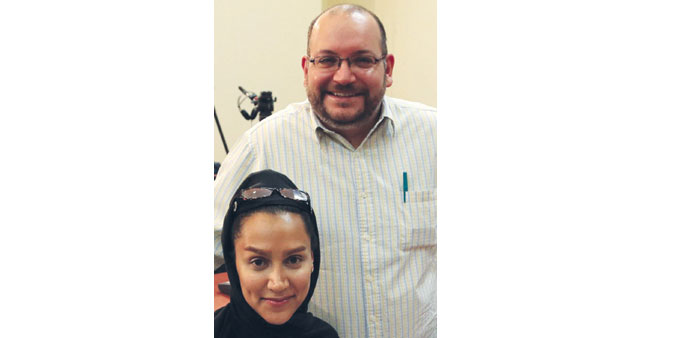 A file picture shows Jason Rezaian and Yeganeh Salehi posing while covering a press conference at Iranu2019s foreign ministry in Tehran on September 10, 2