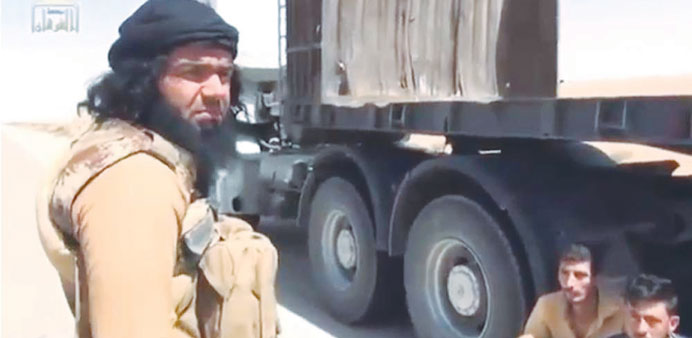 Fahdawi was shown in the video questioning four truck drivers in an attempt to determine their sectarian identity